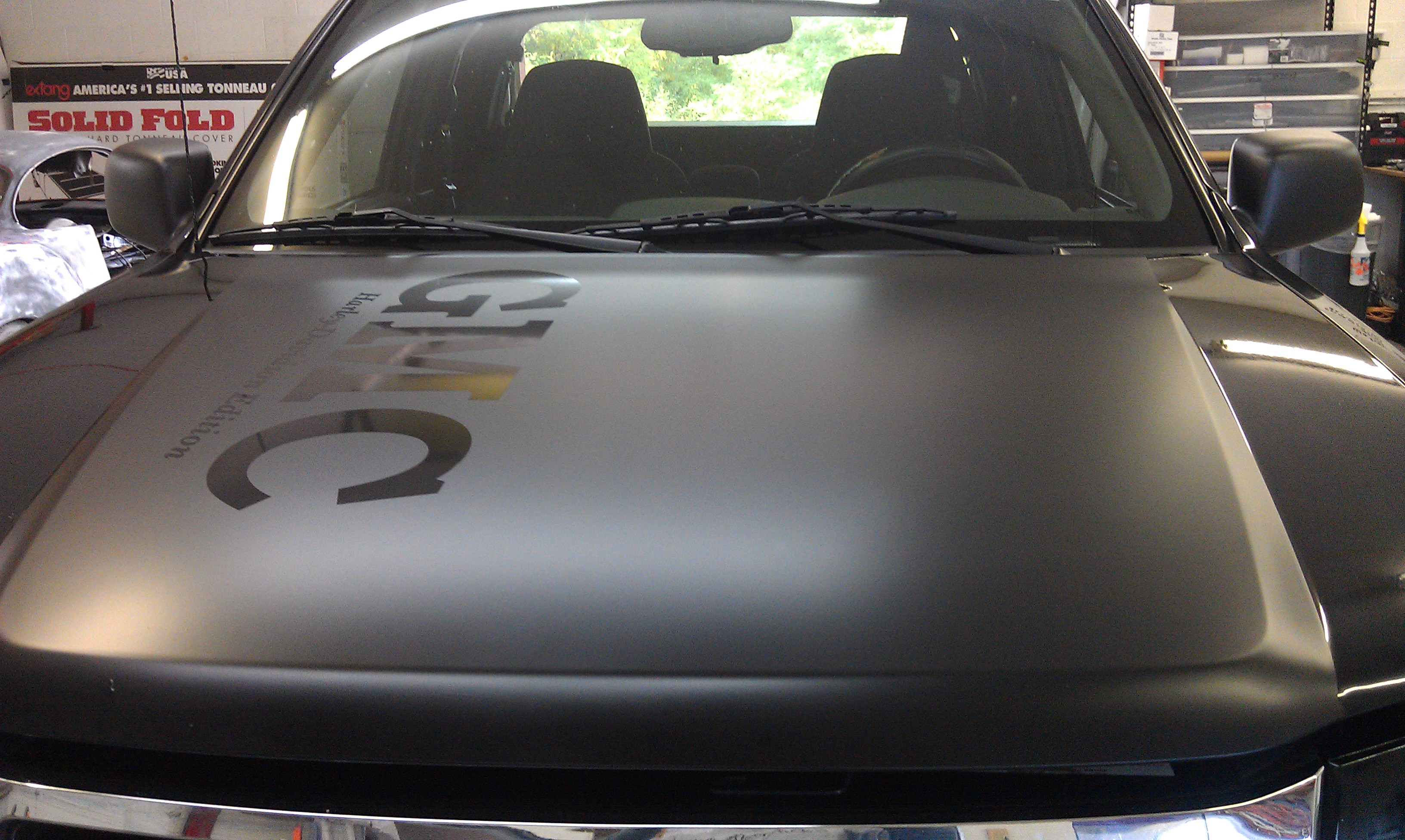 2005 Chevy Canyon flat black hood with vinyl lettering.jpg